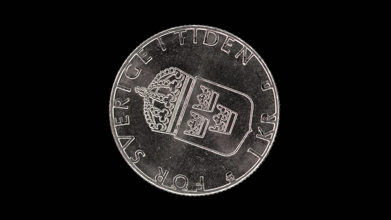 Sweden 1989 1 krona coin reverse with crowned lesser coat of arms rotating on black background