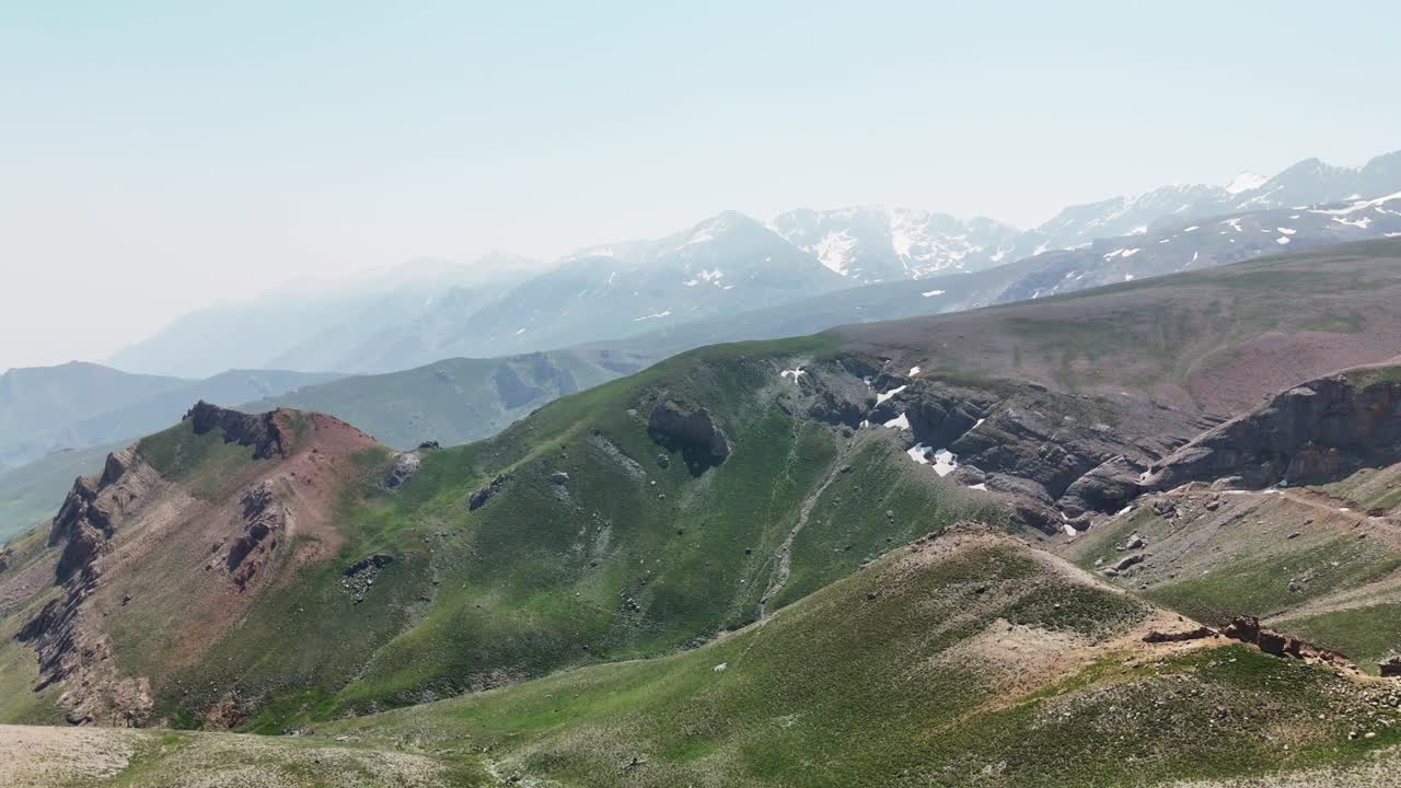 Peaceful aerial view of Cappadocia's rolling green hills in Turkey