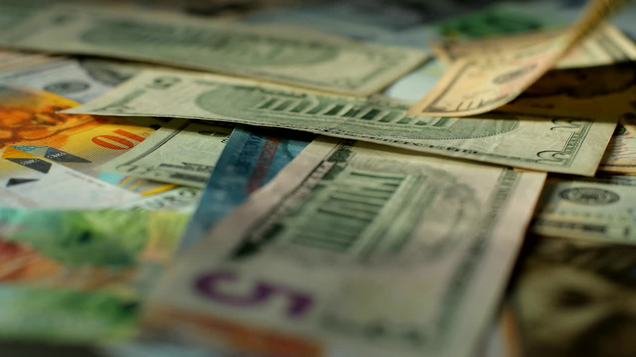 Euro, US dollar, international paper money. Main word currency US Dollar and Euro, Swiss Frank bank notes rotating concept business background, loop ready