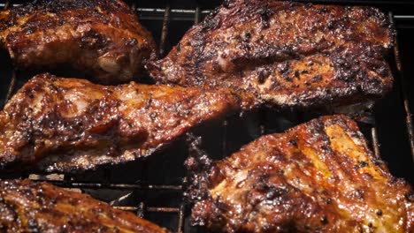 Tasty-ribs-cooking-on-barbecue-grill-for-summer-outdoor-party