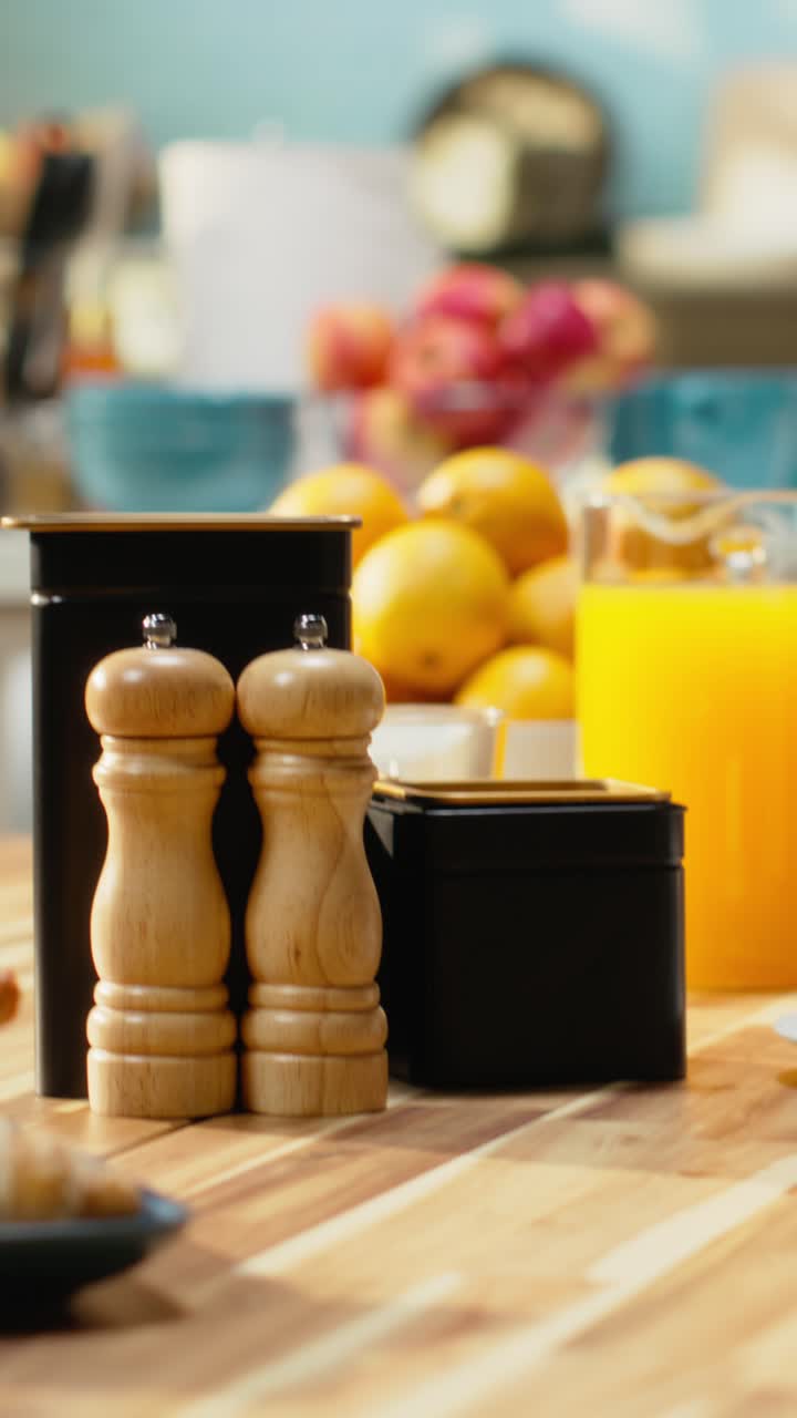 Vertical Video Empty breakfast table in a modern kitchen featuring croissants on plate