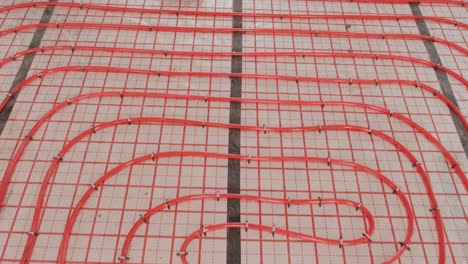 installing underfloor heating pipes for water heating. heating systems. pipes for a heat-insulated floor.