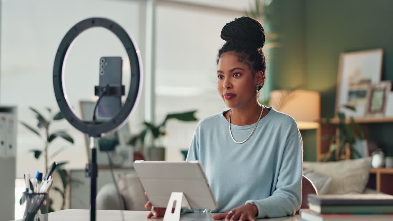 Woman creating content with a ring light and tablet