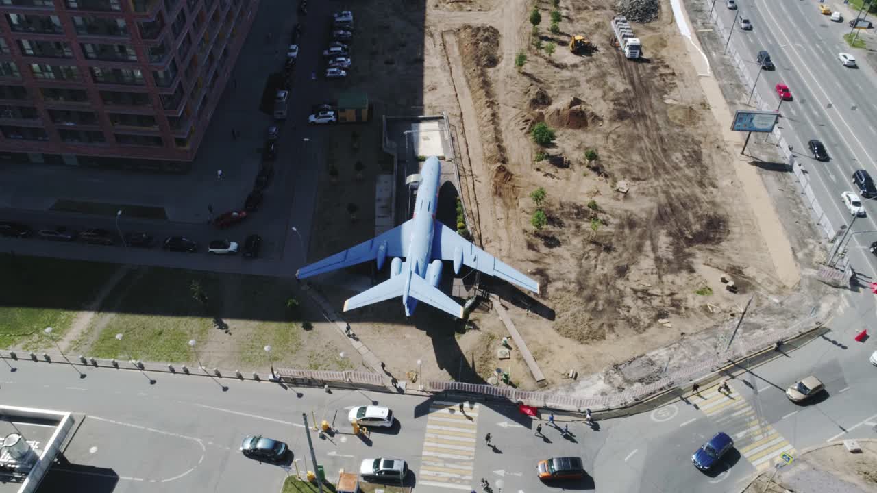Airplane in urban area of Russia, surrounded by construction sites, Moscow, 4K