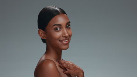 happy, skincare and face of a woman on a studio