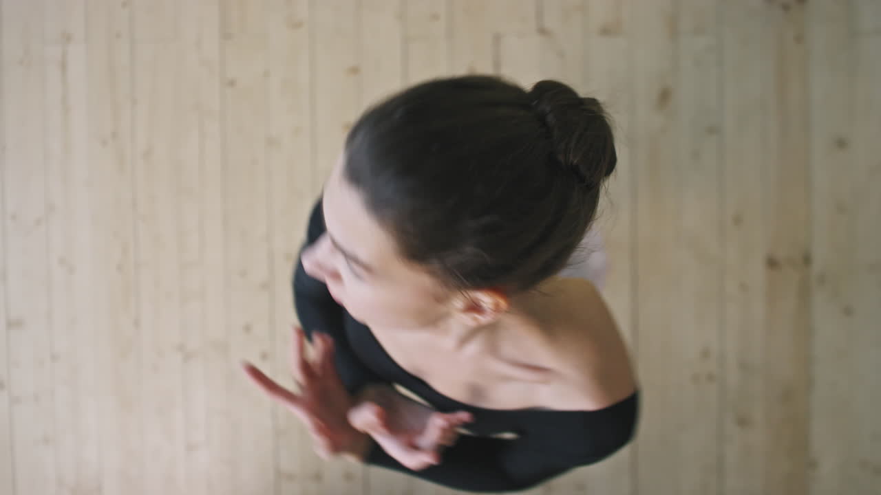 Top View Of Elegant Ballerina Dancing In Ballet Studio