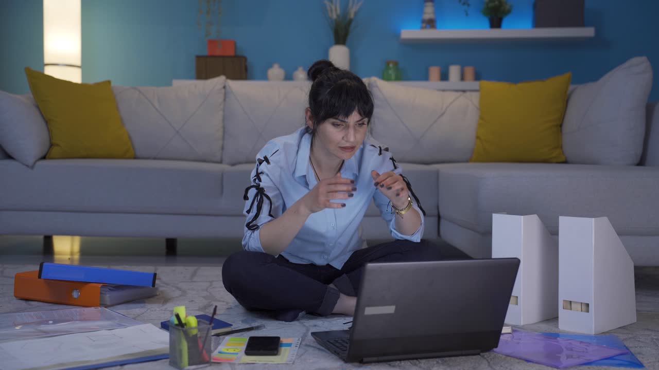 Home office worker woman's hands are shaking.