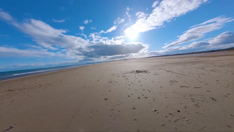 trippy fast aerial flight of fpv capturing mesmerizing landscape of sunny beach