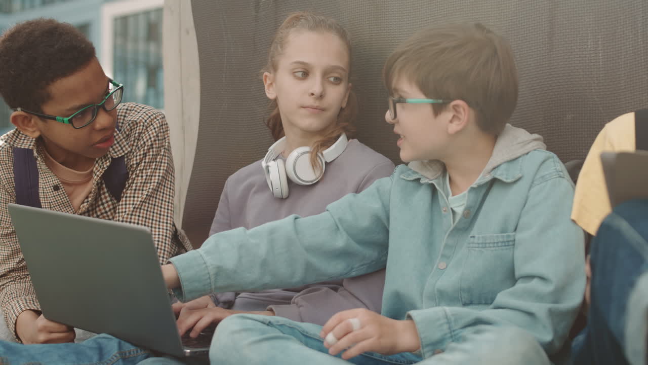 Children Preparing School Project on Laptop Outdoors