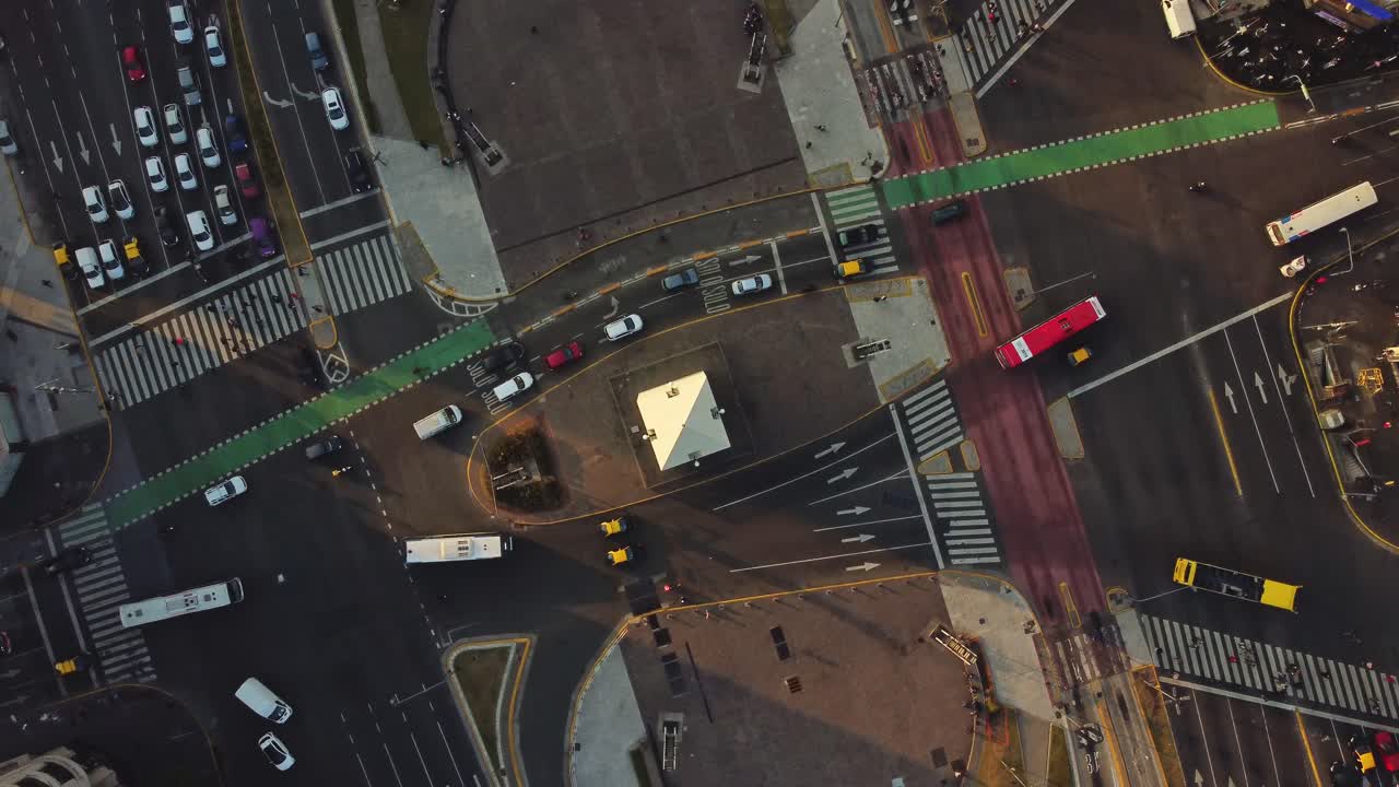 Aerial Top-Down View of Busy City Intersection with Moving Traffic