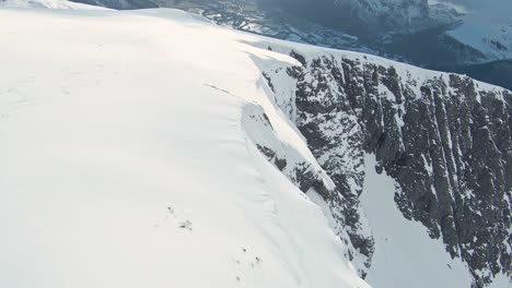 Mountainous-landscape-of-winter-Norway-in-fpv-drone-view