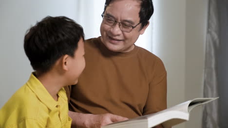 asian man and boy in the bedroom