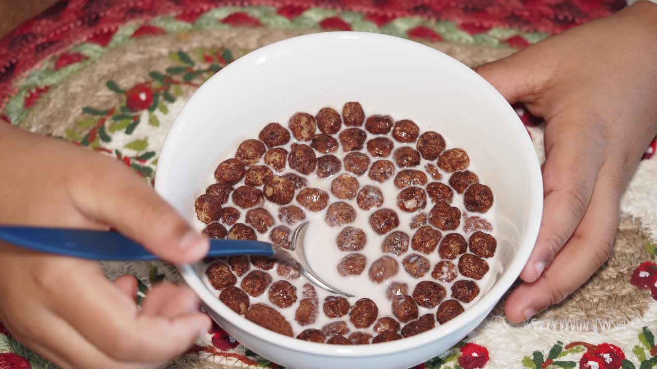 Child Eating Chocolate Cereal