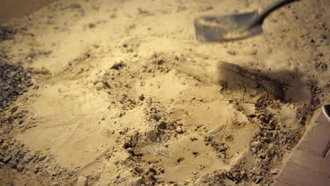 man digging out a hole using a shovel