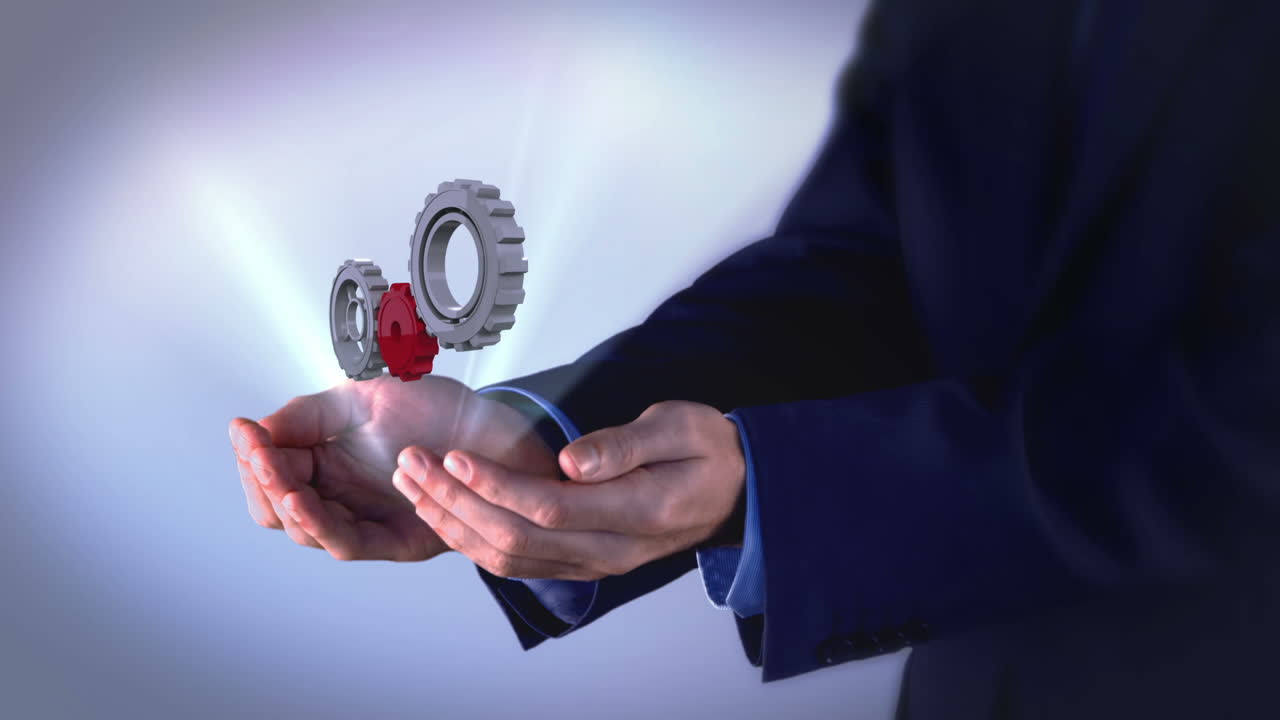 бизнесмен, представляющий зубчатые колеса и колеса