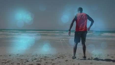animación de un hombre afroamericano estirándose en la playa sobre puntos de luz