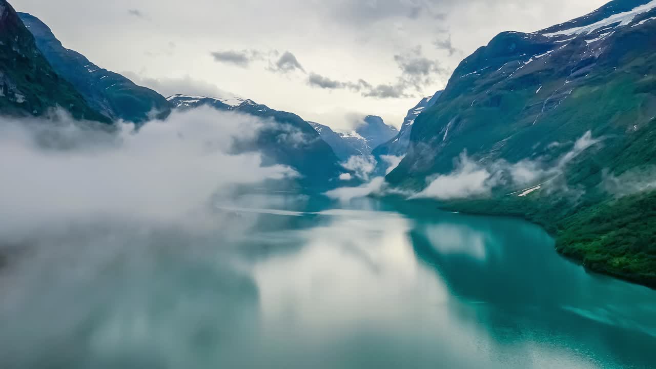 Beautiful Nature Norway natural landscape lovatnet lake flying over the clouds.