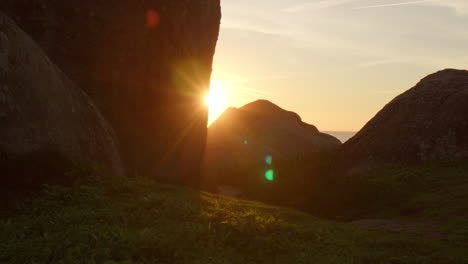 sunset in portugal behind rocky cliff, motion view