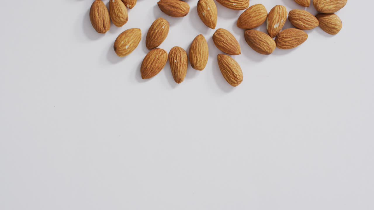 Video of almonds on white background