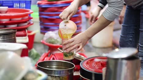 two people collaborating in a busy kitchen setting