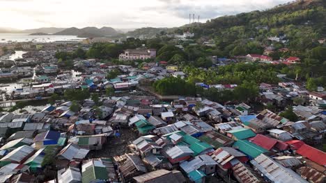 old wooden houses on the fishing village in coron island, philippines. aerial pullback shot
