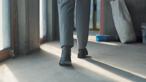 construction worker walking on a construction site