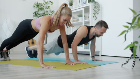 Couple Doing Push-Ups at Home