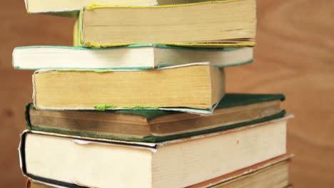 stack of various books on a desk