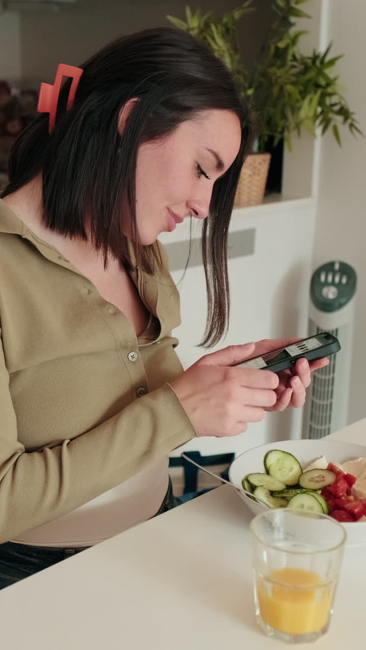 Woman Enjoys Healthy Breakfast and Phone