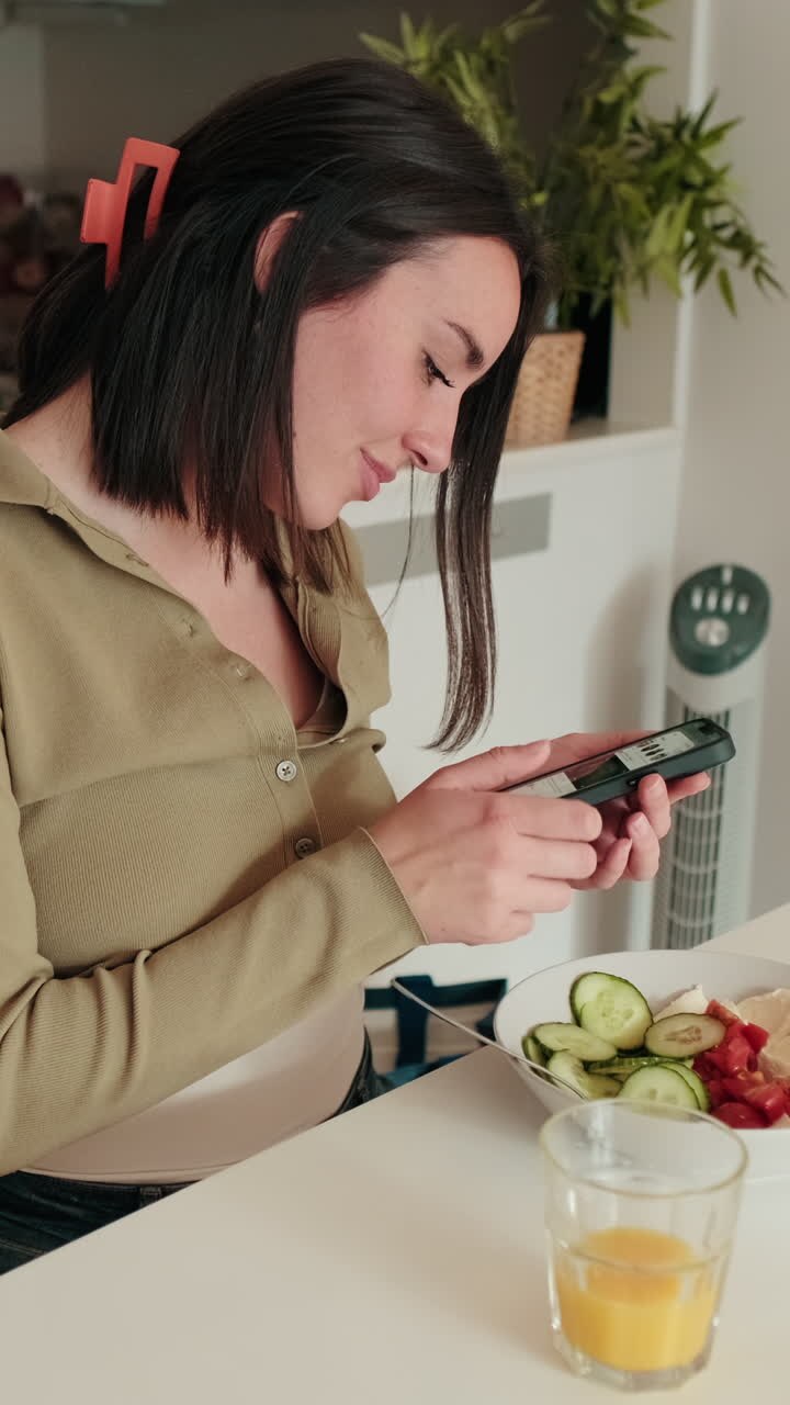 Woman Enjoys Healthy Breakfast and Phone
