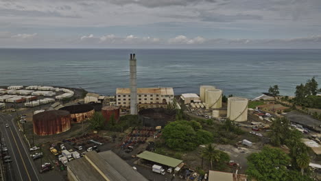 kahului maui hawaii aerial v4 drone flyover harbor capturing cruise ship, container terminals at hobron point, shipyard and townscape against dark cloudy sky - shot with mavic 3 cine - december 2022