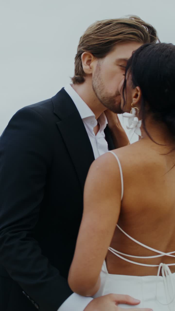 A couple celebrating their wedding on the beach