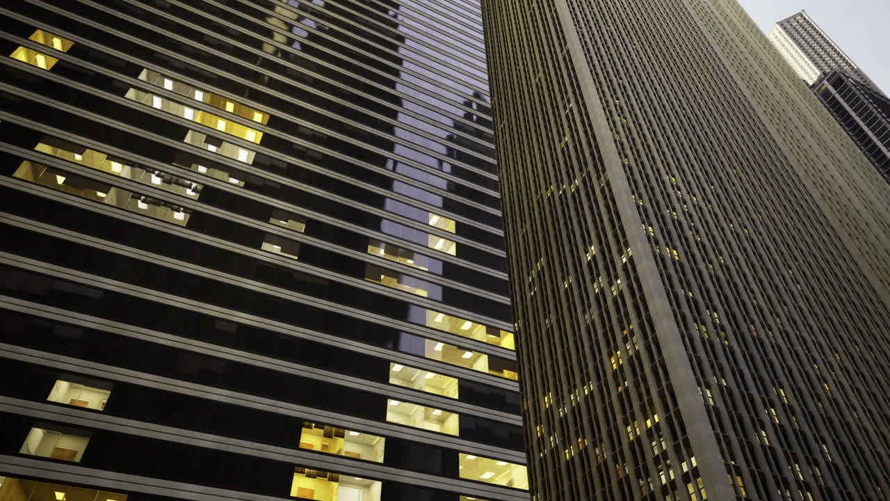 Modern skyscrapers illuminate the urban skyline at dusk in the city