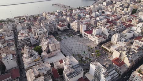 Drone-arc-shot-around-historic-Georgiou-I-Square-near-Old-Port-of-Patras,-Greece