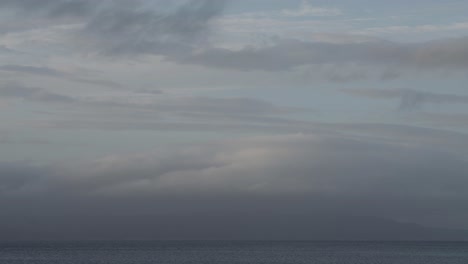 time lapse footage of moving clouds over fjord in norway
