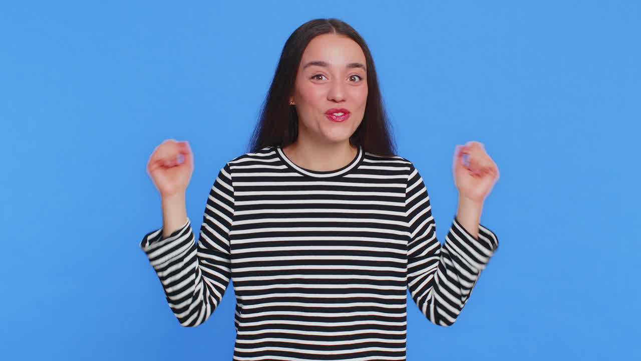 Excited amazed woman surprise looking at camera with big eyes shocked by sudden victory wow emotion