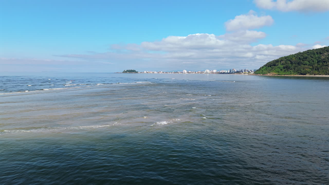 Sandbanks emerging from the top of the seawater at Praia de Caieiras, Guaratuba, Paraná, Brazil