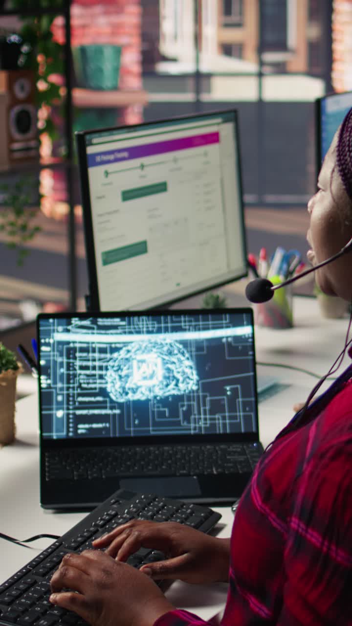 Vertical video Call center employee using AI chatbot at office desk to reply to customers