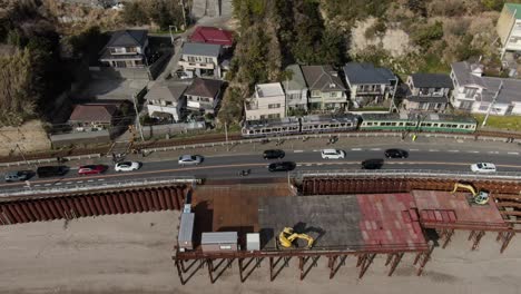 a train running by the sea