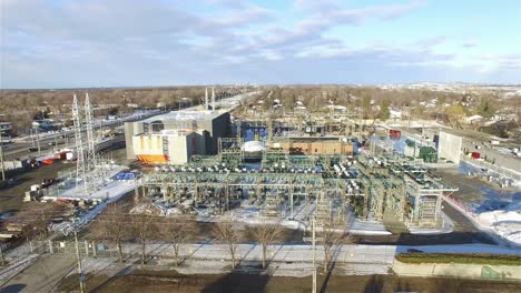 aerial - a power plant in winter in ottawa, canada, wide shot forward