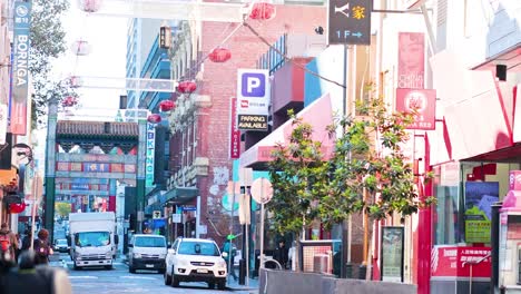 pedestrians and vehicles in vibrant urban setting