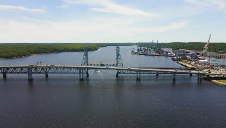 drone descending shot of the sagadahoc bridge over the kennebec river in bath