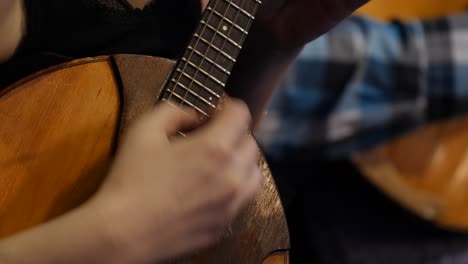 woman playing a string instrument