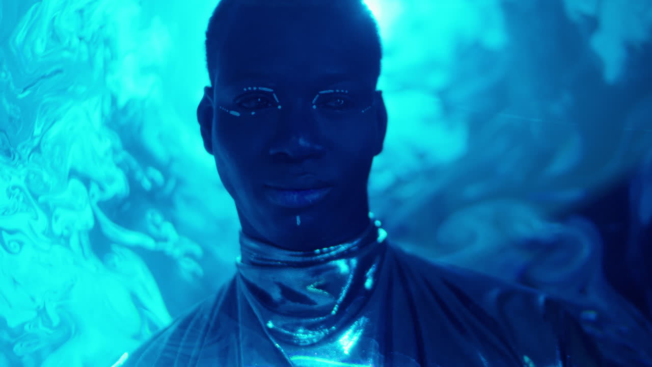 Portrait of Man with Dark Eyes and Creative Makeup in Laser Light