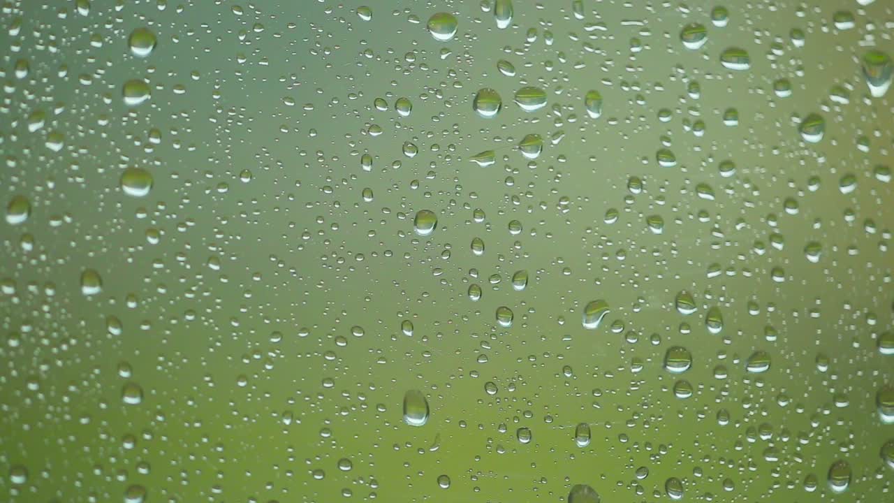 Water drops on a window during a rainstorm