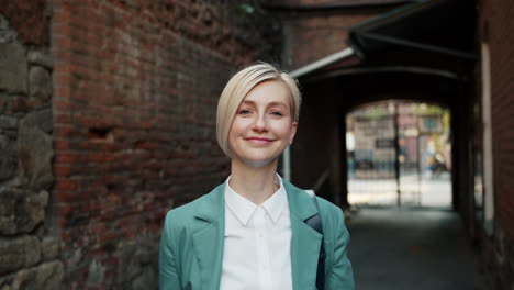 woman greeting in urban alley