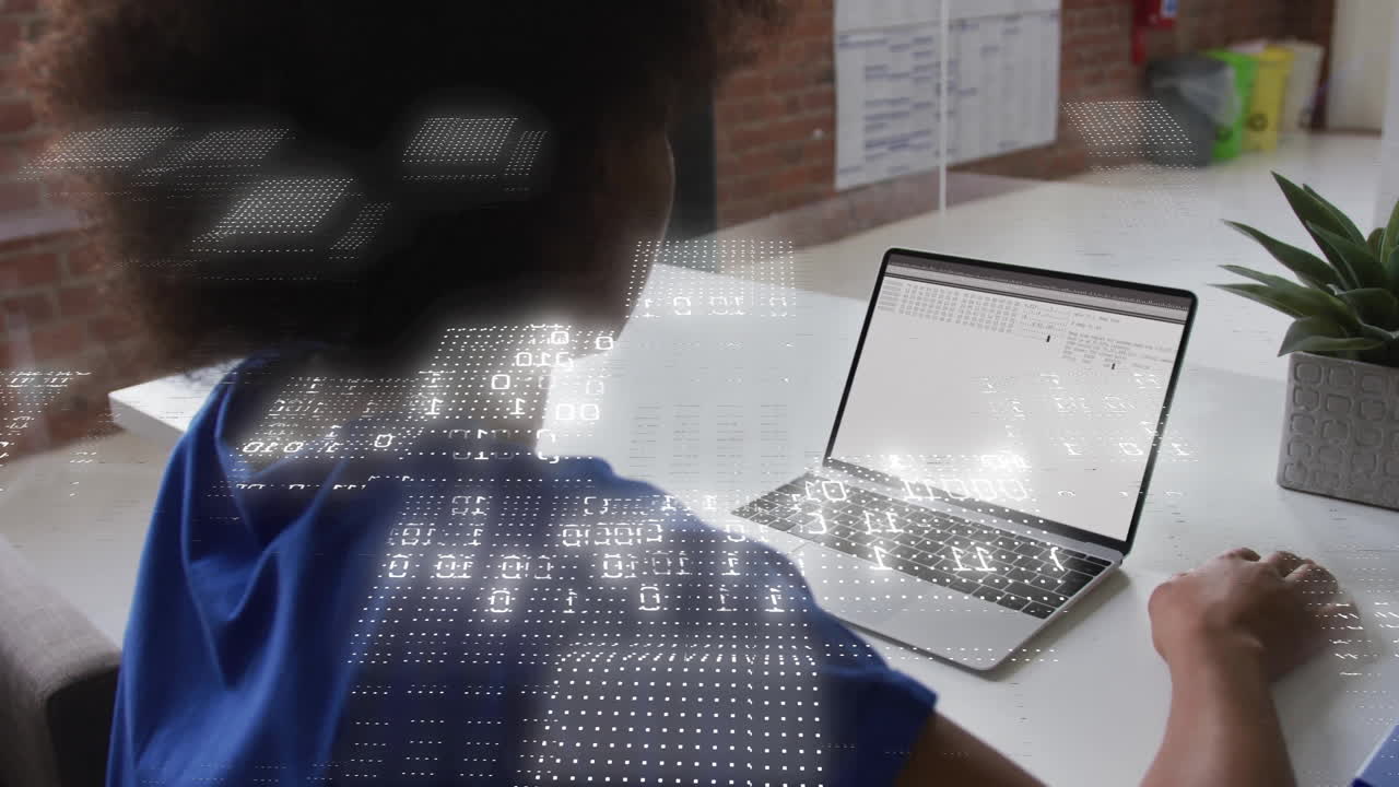 Person working on laptop with digital data processing animation overlay