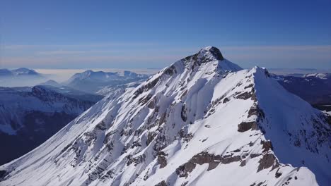 High-Pass-Over-Snow-Covered-Spines-Of-An-Alpine-Hill