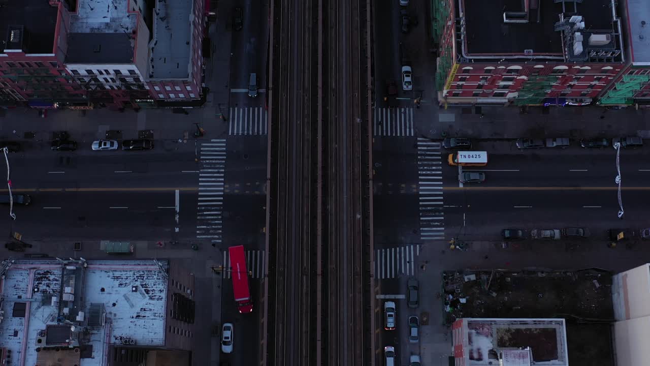Epic drone pan up perpendicular along train tracks in harlem just after ...