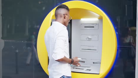 man using a cash machine or atm
